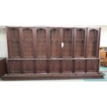 A LARGE VICTORIAN MAHOGANY GOTHIC REVIVAL BOOKCASE, with seven pierced grill doors above seven