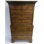 A GEORGE III MAHOGANY SECRETAIRE CHEST ON CHEST the dentil cornice above blind fretwork frieze,