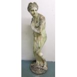 A COMPOSITION STONE GARDEN STATUE OF VENUS BATHING, on circular base, 162cm high Condition Report: