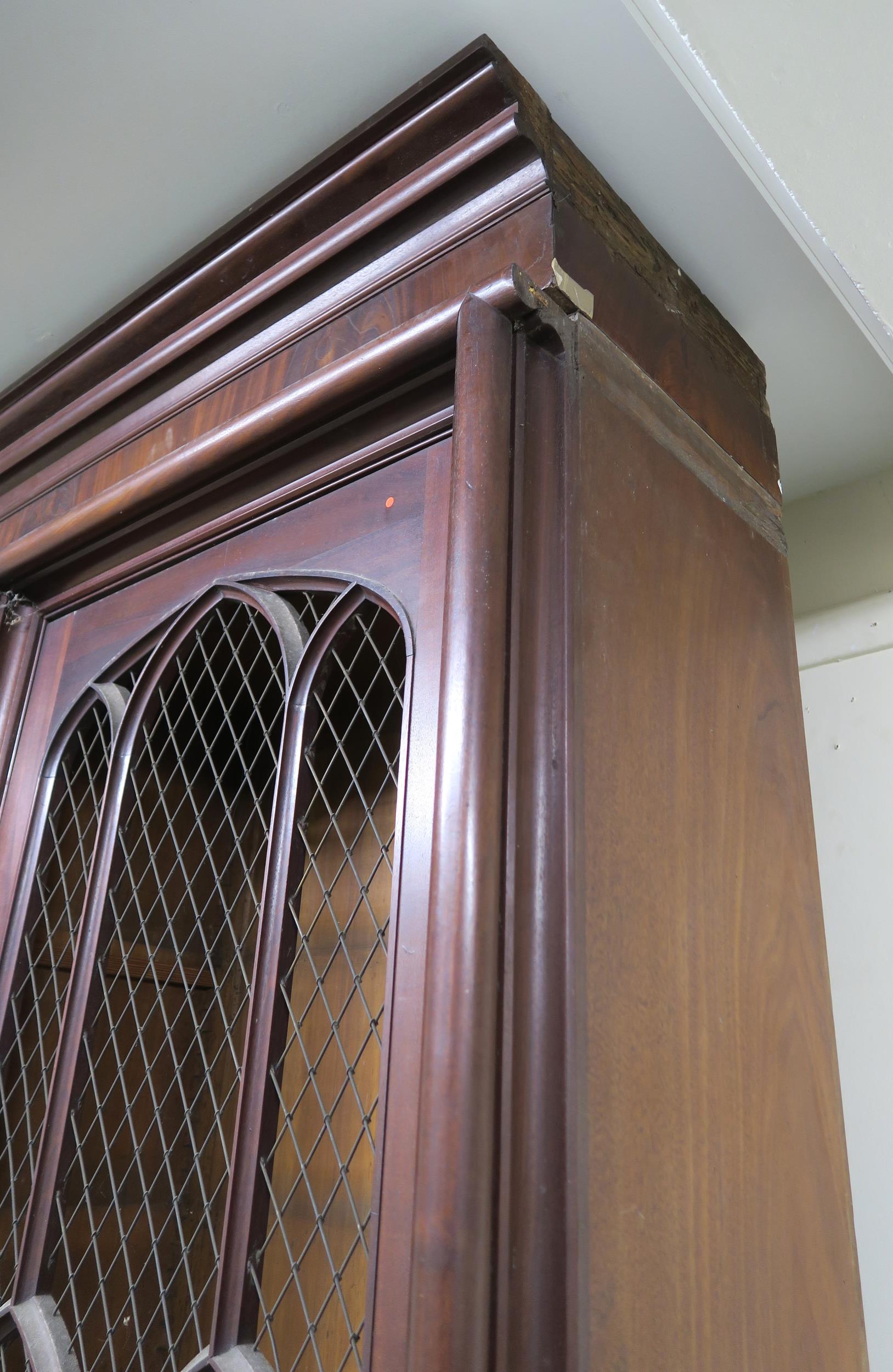 A VICTORIAN MAHOGANY GOTHIC REVIVAL BOOKCASE, with three pierced grill doors above three stylized - Image 6 of 10