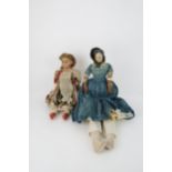 AN EARLY PAPIER MACHE SHOULDER HEAD DOLL with painted features, with dress and bonnet, 69cm long and
