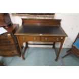 A Victorian mahogany two drawer writing desk on square stretched supports Condition Report:Available