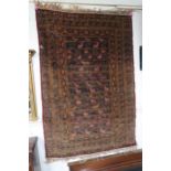 A dark blue ground eastern tribal rug with allover design depicting stylized animals, 136cm long x