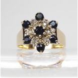 A 9ct gold sapphire and diamond accent flower ring, size P, weight 4.3gms Condition Report:Available