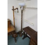 An early 20th century mahogany barley twist standard lamp, another standard lamp and a mahogany nest