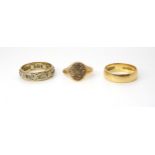 An 18ct gold wedding ring, hallmarked 1960, size L, weight 3.7gms together with two 9ct gold rings