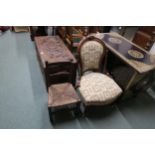 A Victorian mahogany nursing chair upholstered in Lion rampant pattered fabric and a rushed seat