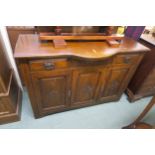 A 20th century oak sideboard with three drawers above three cabinet doors Condition Report:Available