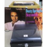 A Steepltone ST-938 vinyl record player together with a collection of rock, pop and folk vinyl LP