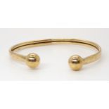 A 9ct gold bangle, weight 9.1gms Condition Report:Available upon request