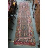 A multicoloured Caucasian runner with allover design and multiple borders, 334cm long x 91cm wide