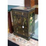 A 20th century oriental black lacquer and floral painted cabinet Condition Report:Available upon
