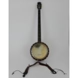 A 5 string Windsor Banjo inlaid to the resonator, together with a vintage leather strap and case