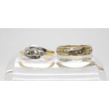 An 18ct gold and platinum three stone diamond ring,(af) two remaining diamonds have a combined total