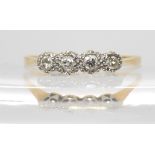 An 18ct gold and platinum four illusion set diamond ring, size V, weight 2.3gms Condition Report: