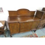 A 20th century mahogany sideboard with three central drawers flanked by cabinet doors on claw and