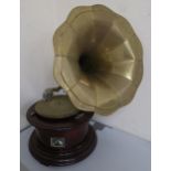 A His Mater's Voice wind up gramophone with a brass sound horn Condition Report:Available upon