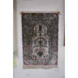 A cream ground tree of life prayer rug with extensive floral and foliate details, 91cm long x 62cm