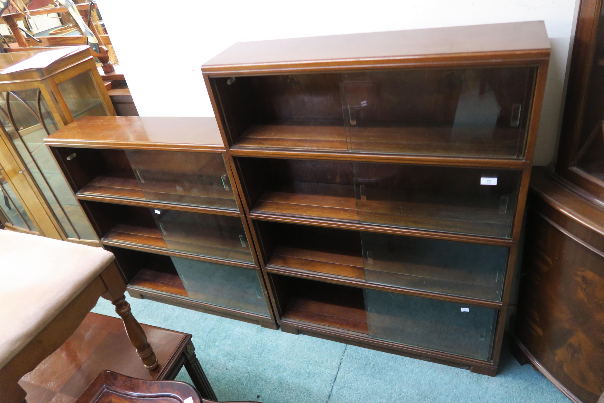 A lot of two 20th century mahogany sectional bookcases with sliding doors (2) Condition Report: