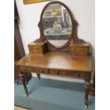 A Victorian burr walnut mirror back dressing table on turned supports Condition Report:Available