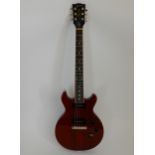A Gibson Les Paul double cut away electric guitar 2015 model in Heritage Cherry with a soft gig