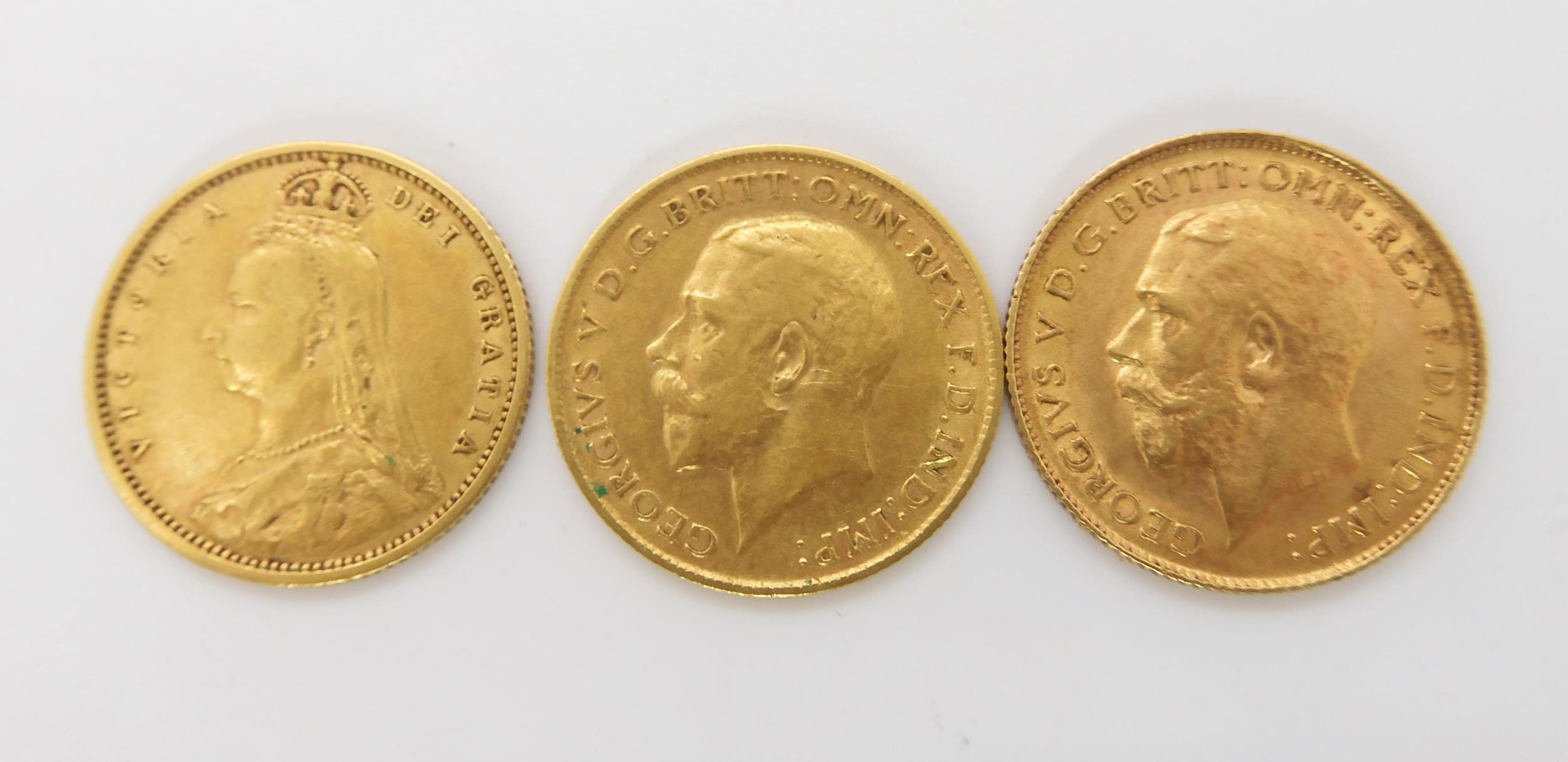 An 1892 Victoria gold shield back half sovereign, together with two George V half sovereigns dated