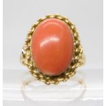 An 18ct gold coral ring, finger size P1/2, weight 5.4gms Condition Report:Available upon request