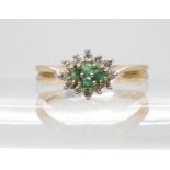 A 9ct gold emerald and diamond cluster ring, finger size O, weight 2.8gms Condition Report:Available