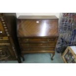 A 20th century mahogany three drawer fall front writing bureau Condition Report:Available upon