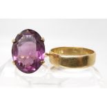 A 9ct gold wedding ring, size X1/2, together with a 9ct gold purple gem set ring, size K1/2,