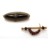 A yellow metal onyx and pearl star mourning brooch, weight 8.4gms, together with a yellow metal