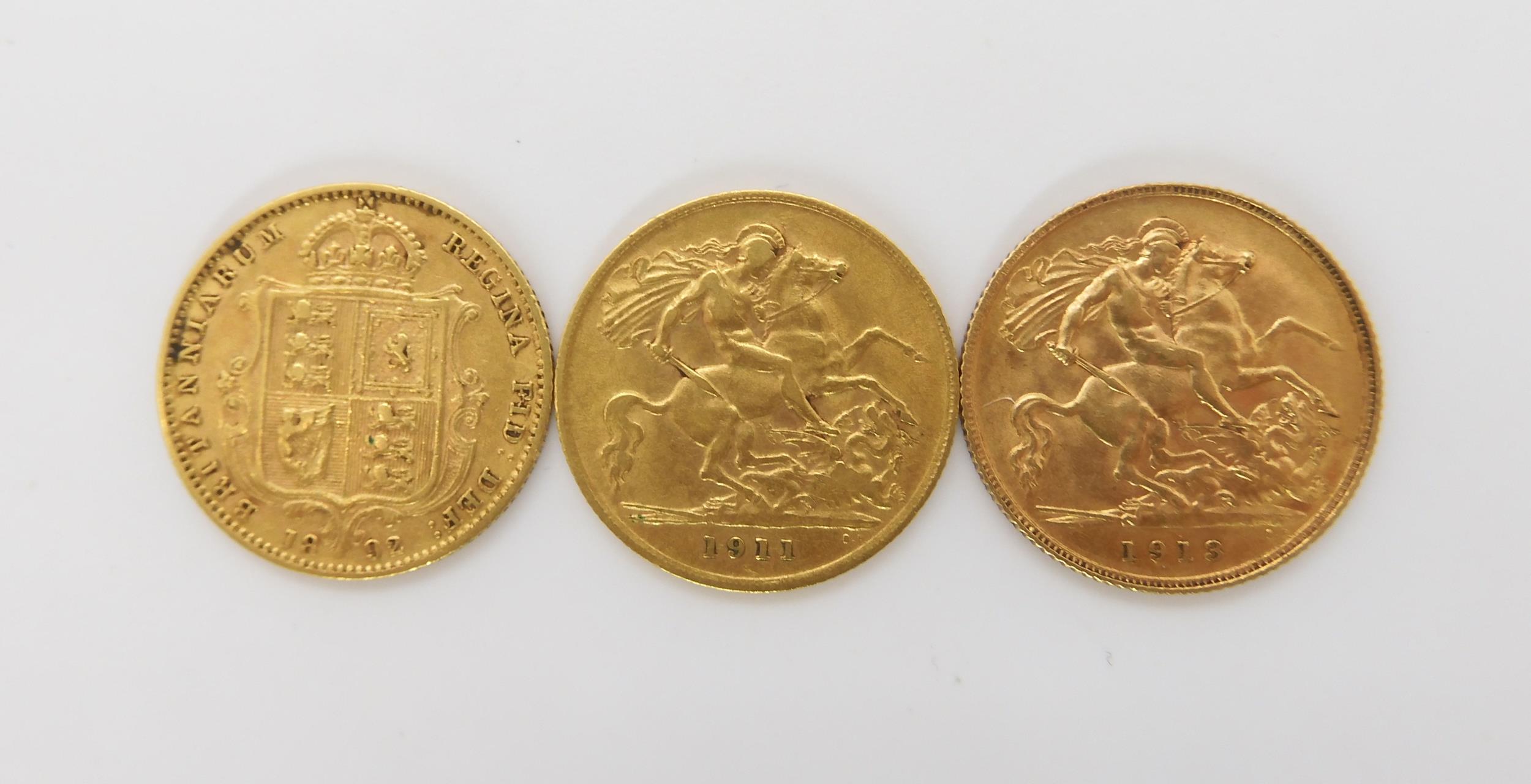 An 1892 Victoria gold shield back half sovereign, together with two George V half sovereigns dated - Image 2 of 2