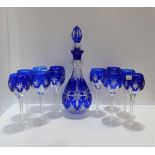 A set of eleven blue flashed and cut glass wine glasses with a matching decanter Condition Report: