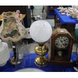 An oil lamp, a barley twist wooden table lamp and a clock Condition Report:Available upon request