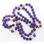 A string of amethyst beads and pearls with a 9ct gold amethyst and pearl clasp Condition Report: