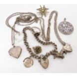 A collection of silver and white metal items to include lockets , pendants, a garnet ring etc