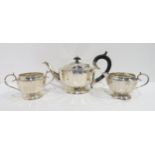 A silver bachelors art deco tea set, of faceted form with scrolling handles, by S. Blanckensee & Son