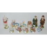 A collection of Beatrix Pottery figures including a gold back stamped Jemima Puddleduck, a brown