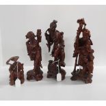 Four carved wooden oriental figures Condition Report:Available upon request