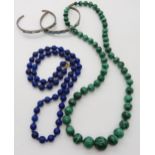 A string of lapis lazuli beads with a 9ct clasp, a string of malachite beads and two white metal and