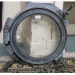 A patinated brass ship's porthole window, the hinge stamped "No. 17A" Condition Report:Available