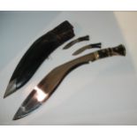 A kukri in leather scabbard Condition Report:Available upon request