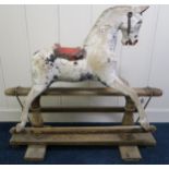 A Victorian white painted rocking horse on pine base Condition Report:Available upon request