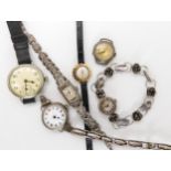 A 9ct gold retro ladies watch, four silver watches and a white metal example Condition Report:Not