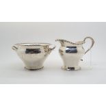 A silver cream jug and twin handled sugar bowl with beaded rims, by R & W Sorley, Glasgow 1910 &