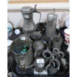 A pewter tappit hen, two pewter jugs and assorted antique pewter mugs Condition Report:Not available