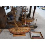 Three scratch built models of boats, another boat and a half hull Condition Report:Not available for