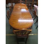A 20th century mahogany dining suite consisting extending dining table and eight chairs,
