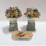 A pair of Royal Worcester urn of flowers ornaments modelled by Mary Leigh, date code for 1938, and a