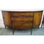 A 20th century mahogany dome fronted sideboard with three central drawers flanked by pairs of